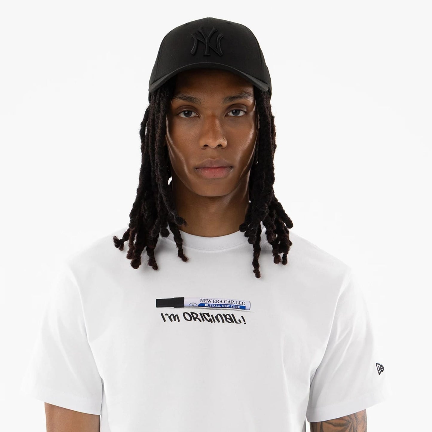 The model is wearing this New Era I Am Original T-Shirt in white. 6