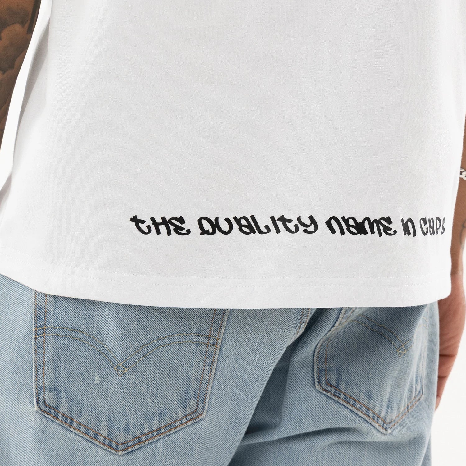 The model is wearing this New Era I Am Original T-Shirt in white. 7