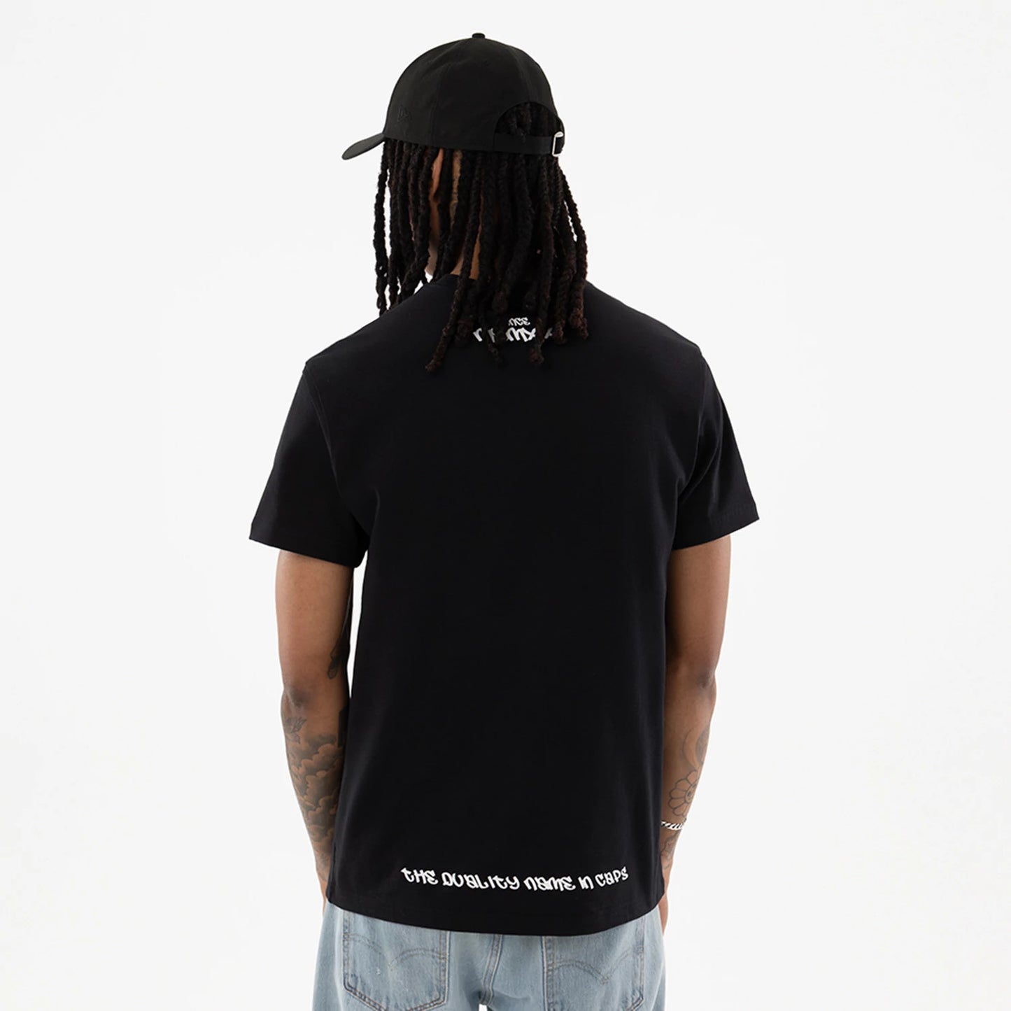 The model is wearing this New Era I Am Original T-Shirt in black. 2