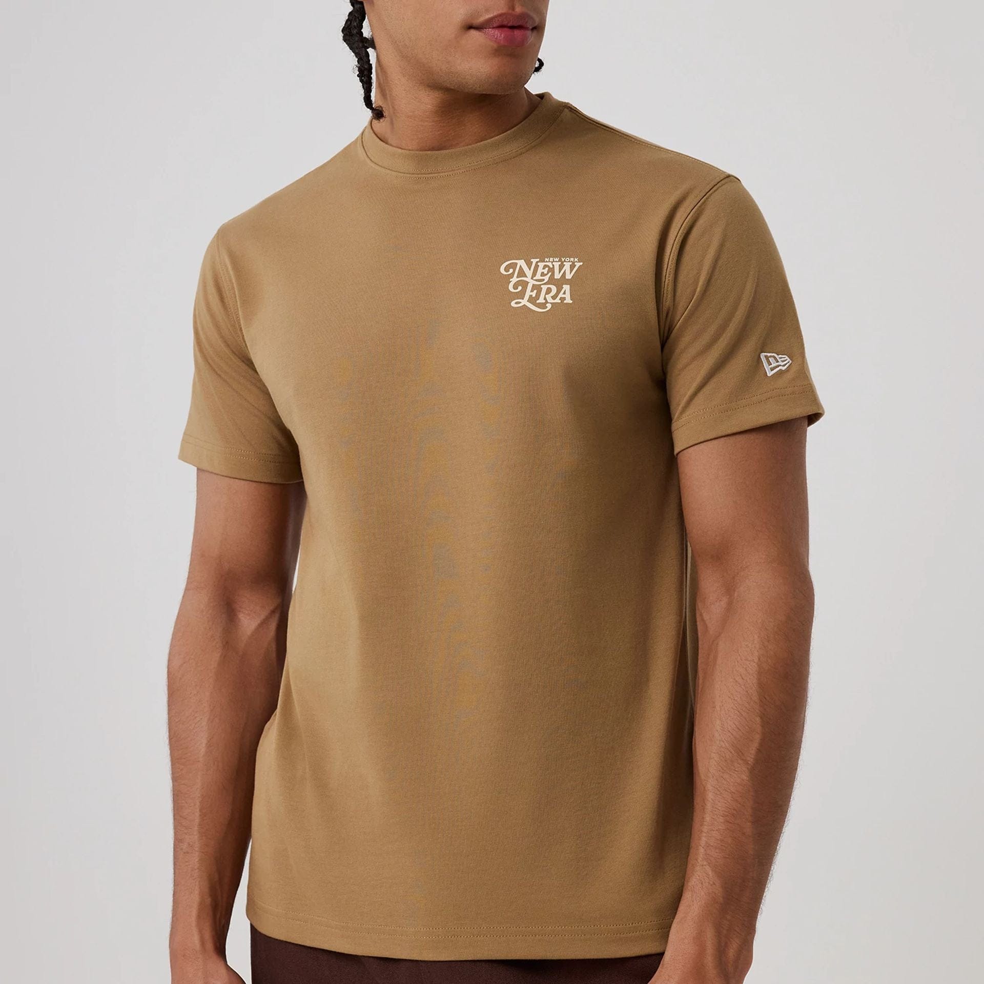 The model is wearing this New Era Script Graphic T-Shirt in Beige. 5