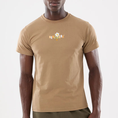 The model is wearing this New Era Earth Day T-Shirt in beige/khaki. 5