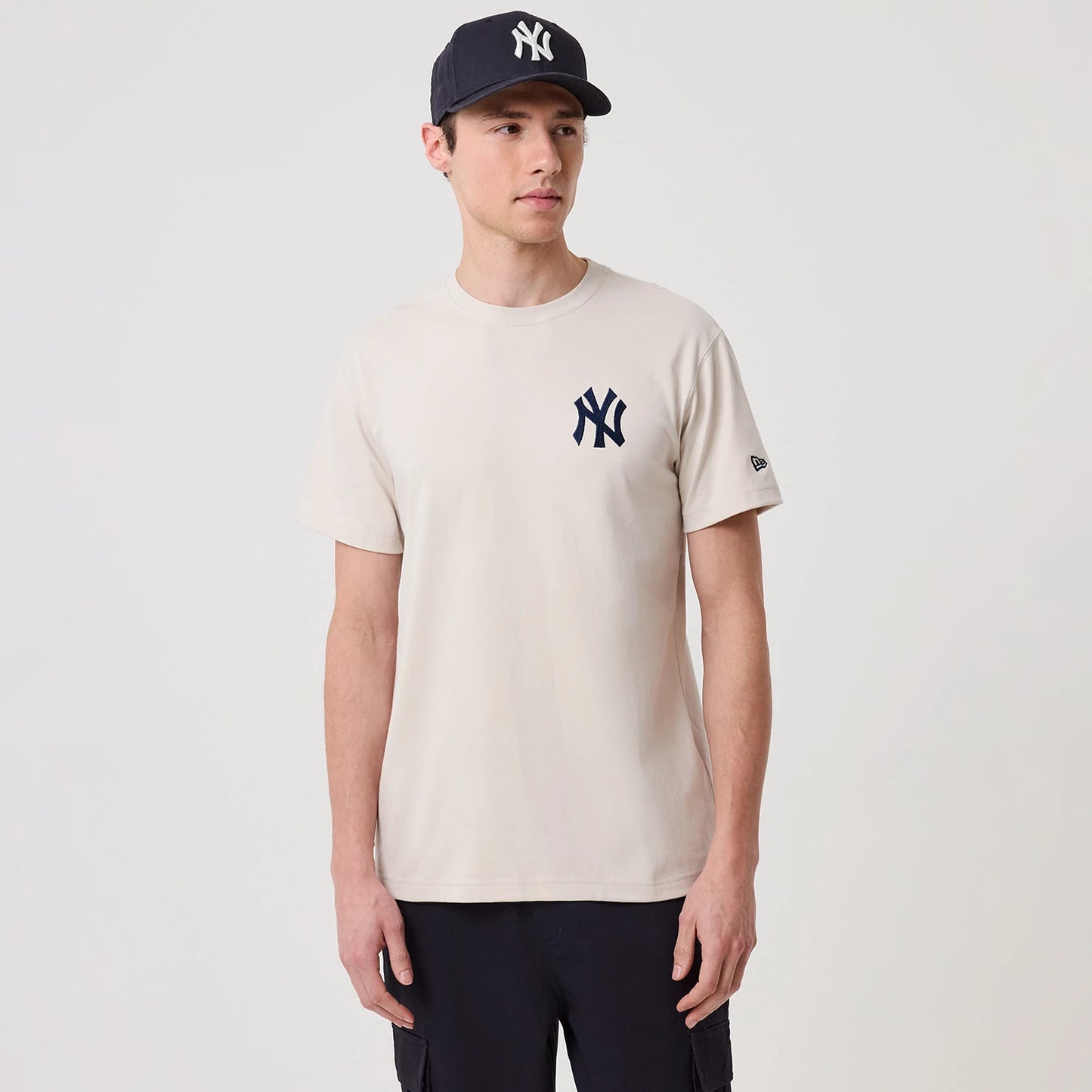 The model is wearing this MLB Banana Graphic New York Yankees T-Shirt in natural. 1