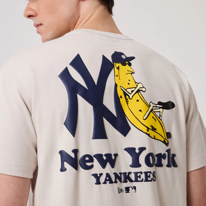 The model is wearing this MLB Banana Graphic New York Yankees T-Shirt in natural. 3