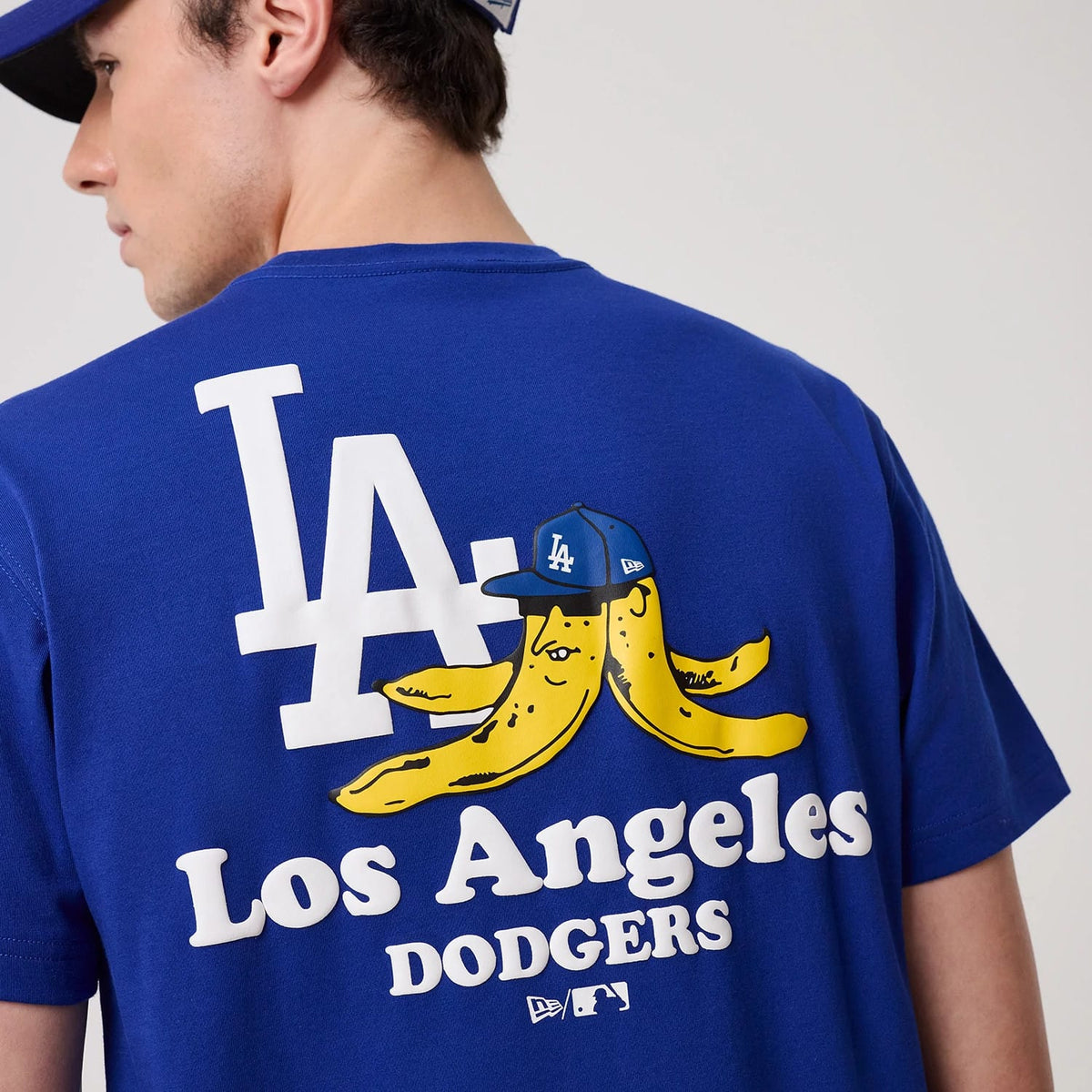 The model is wearing this MLB Banana Graphic LA Dodgers T-Shirt in bright blue. 3