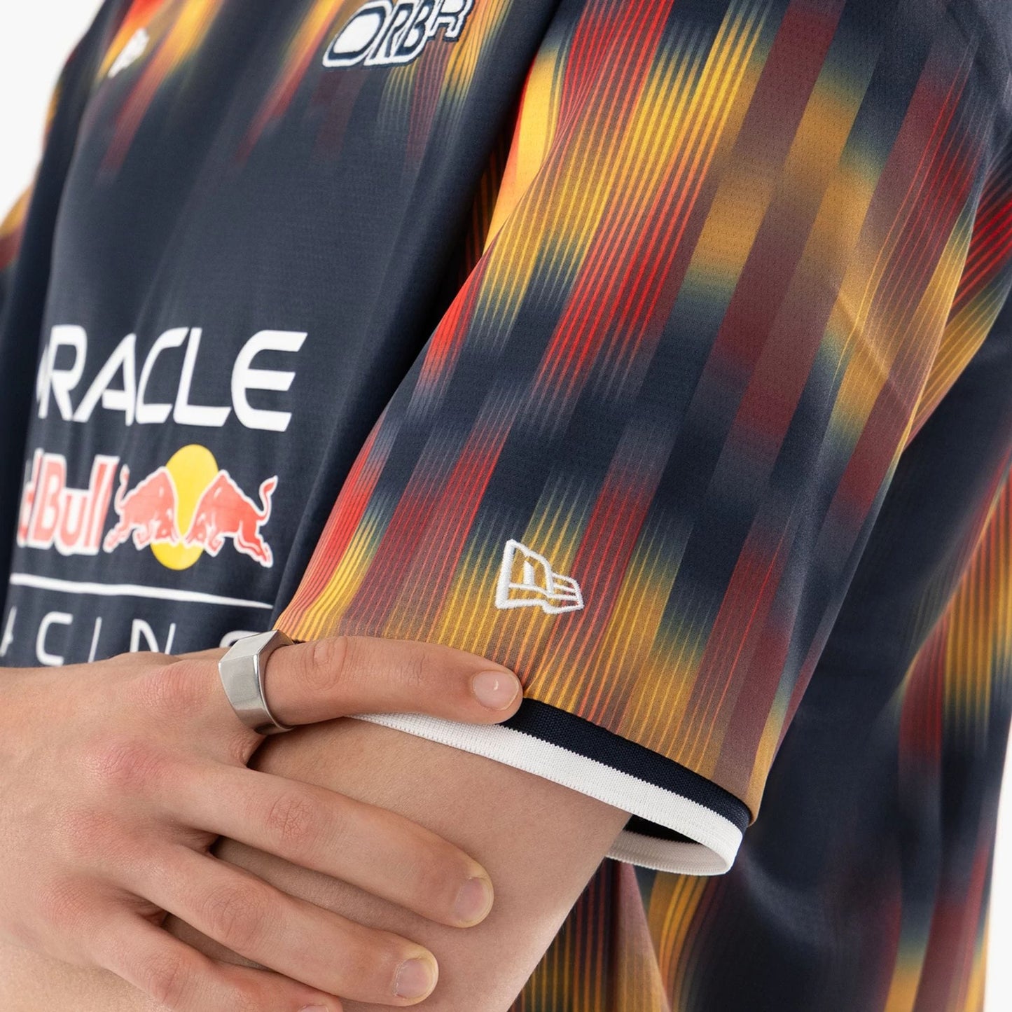 The model is wearing this Red Bull Racing Soccer Jersey in multi. 4