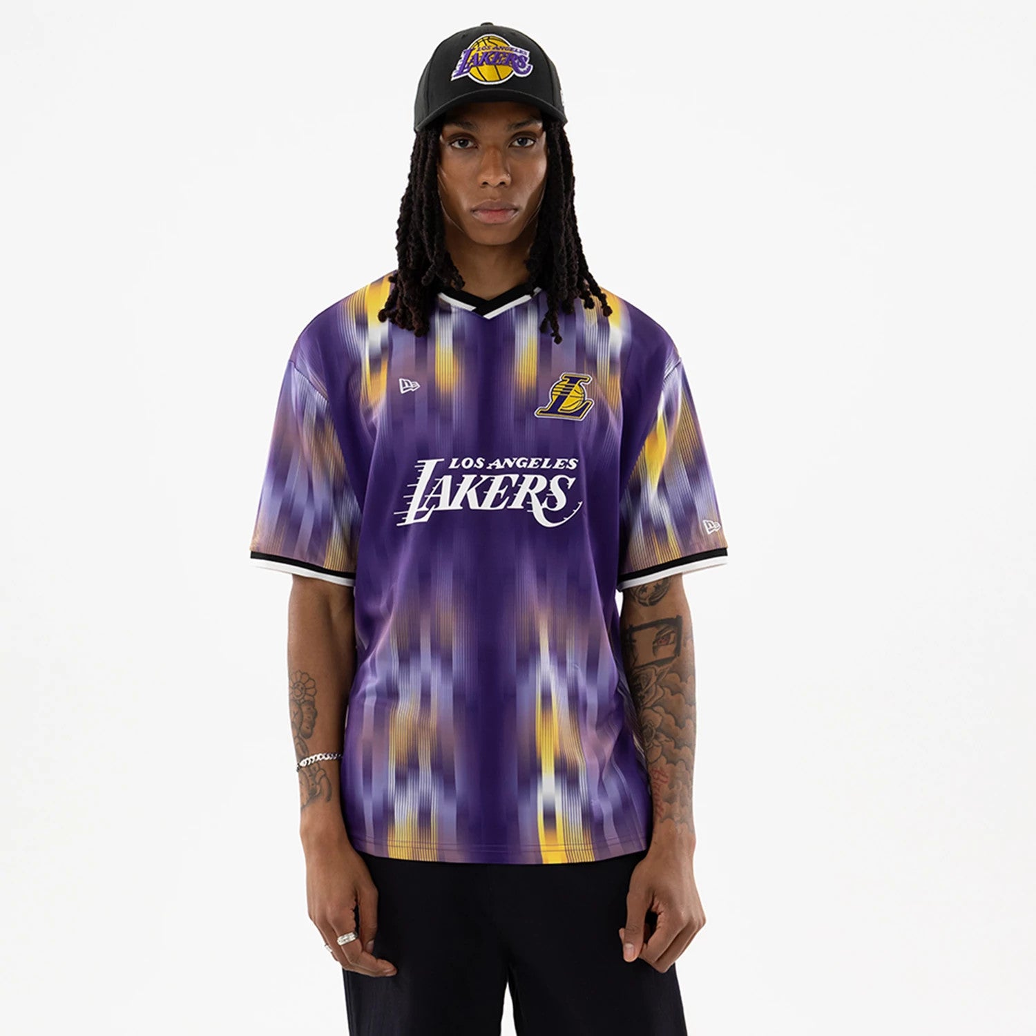 The model is wearing this NBA LA Lakers Soccer Jersey in purple. 1