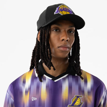 The model is wearing this NBA LA Lakers Soccer Jersey in purple. 6