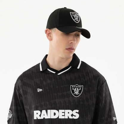 The model is wearing this NFL Las Vegas Raiders Soccer Jersey in black. 6