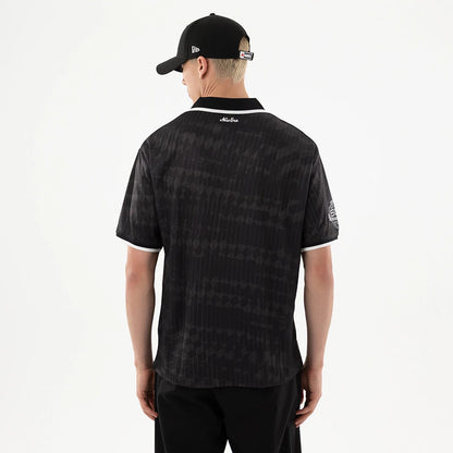 The model is wearing this NFL Las Vegas Raiders Soccer Jersey in black. 2