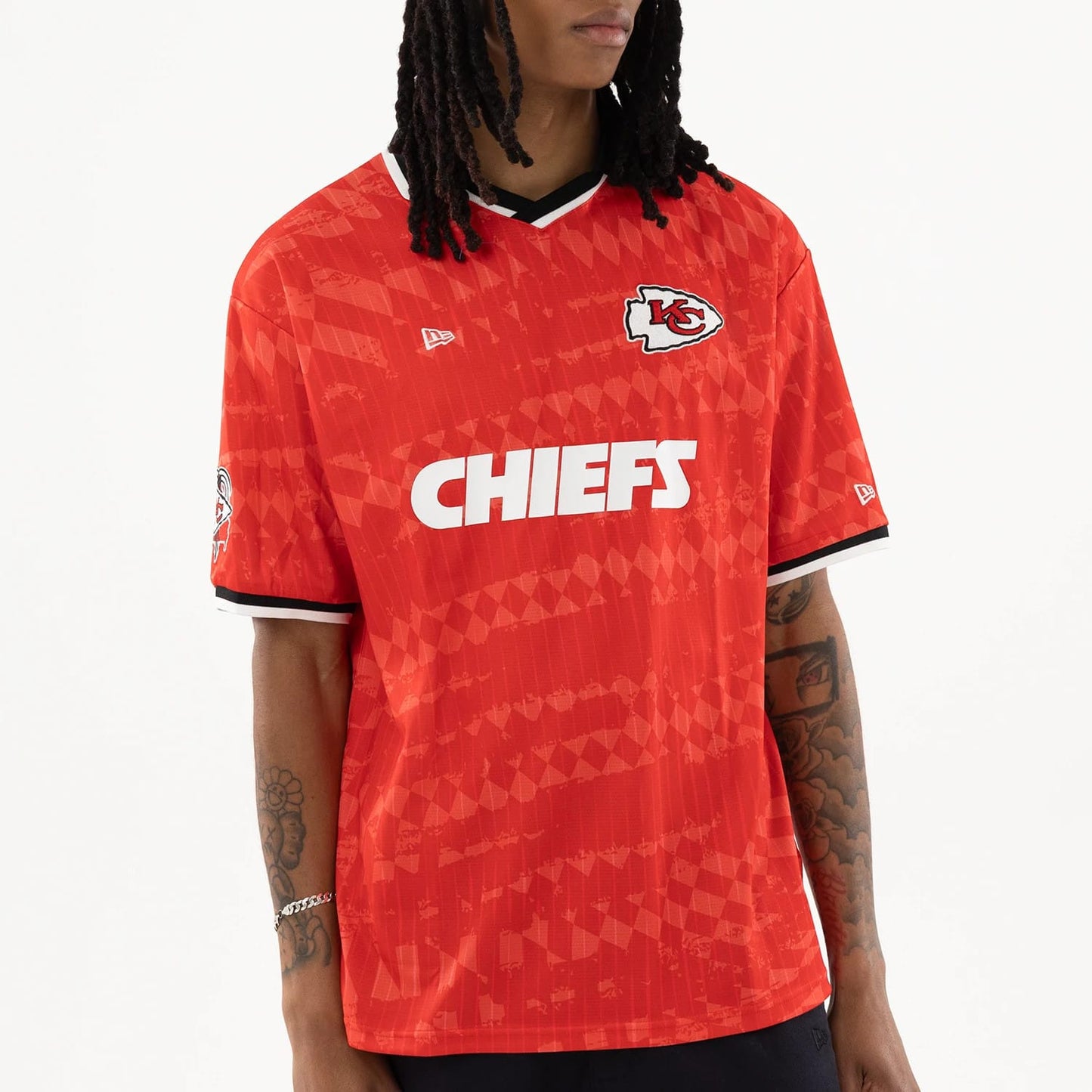 The model is wearing this NFL Kansas City Chiefs Soccer Jersey in red. 3