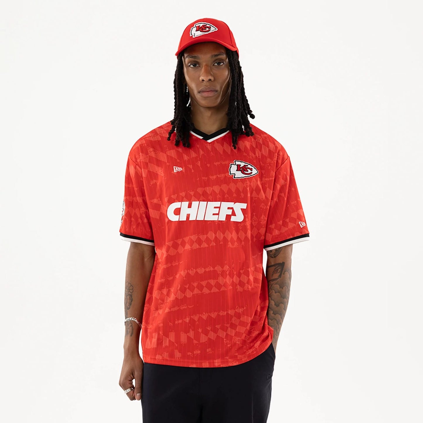 The model is wearing this NFL Kansas City Chiefs Soccer Jersey in red. 1