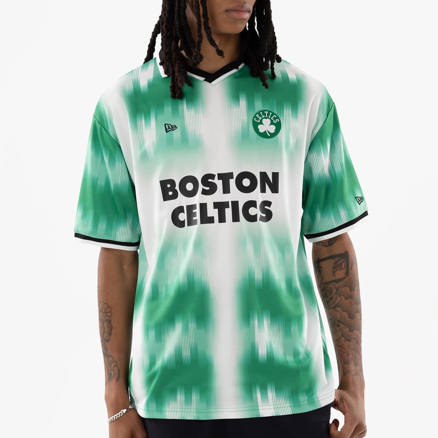 The model is wearing this NBA Boston Celtics Soccer Jersey in green. 3