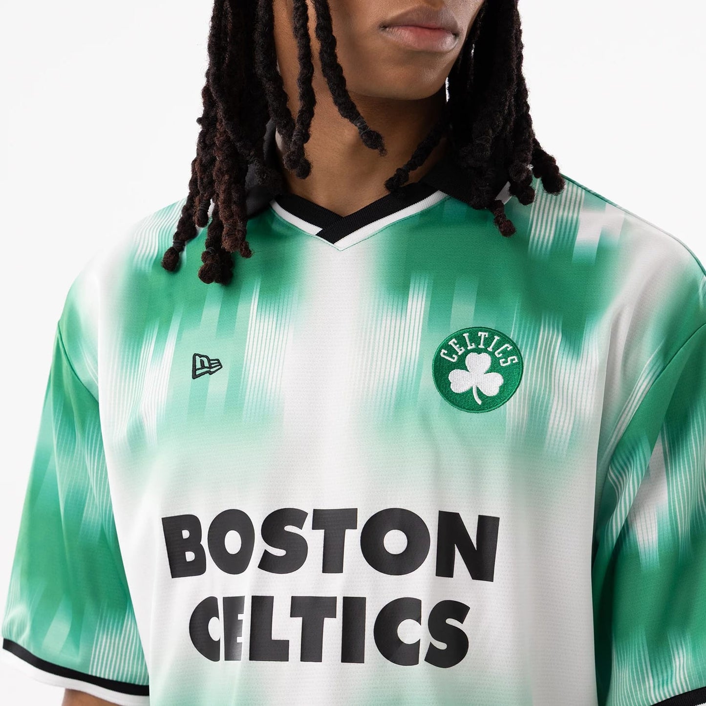 The model is wearing this NBA Boston Celtics Soccer Jersey in green. 4