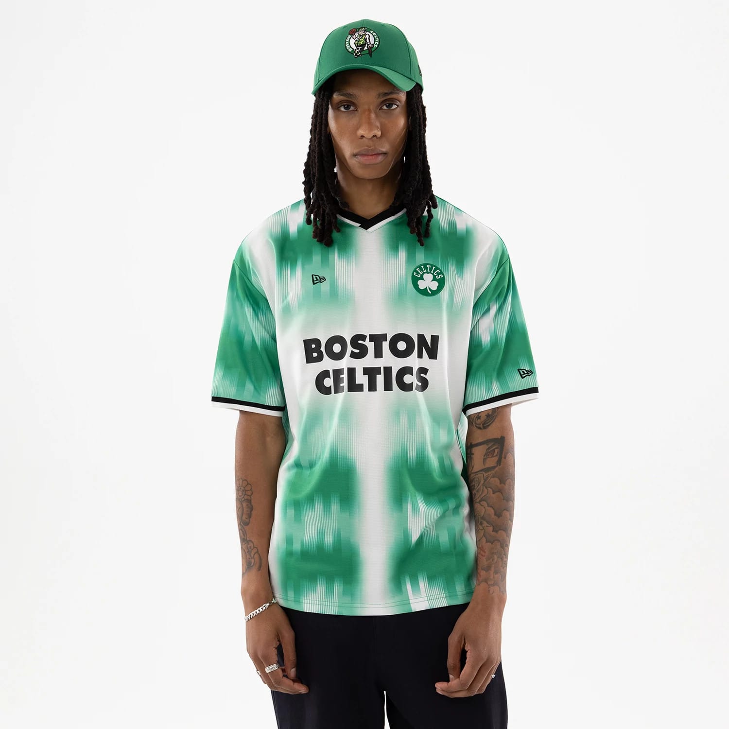 The model is wearing this NBA Boston Celtics Soccer Jersey in green. 1