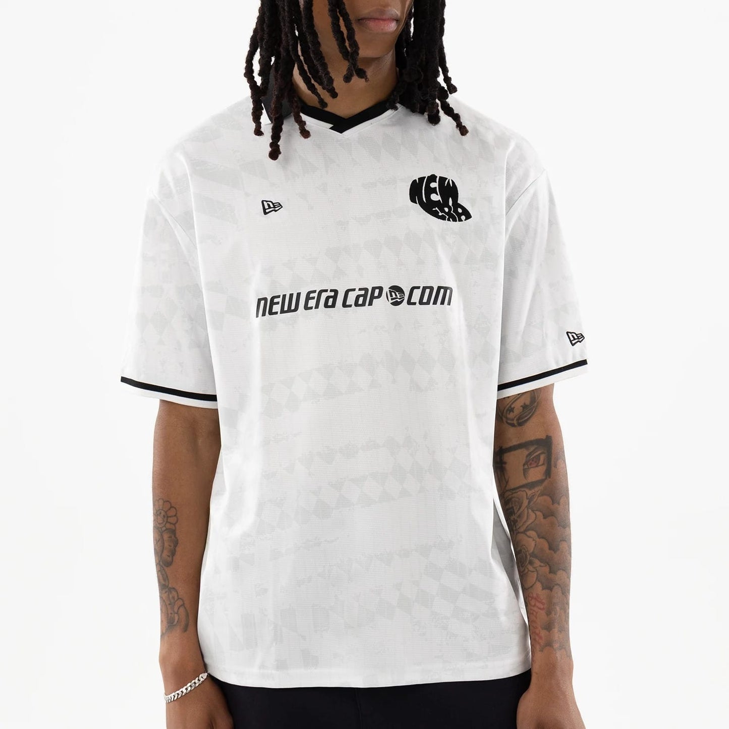 The model is wearing this New Era Soccer Jersey in white. 3