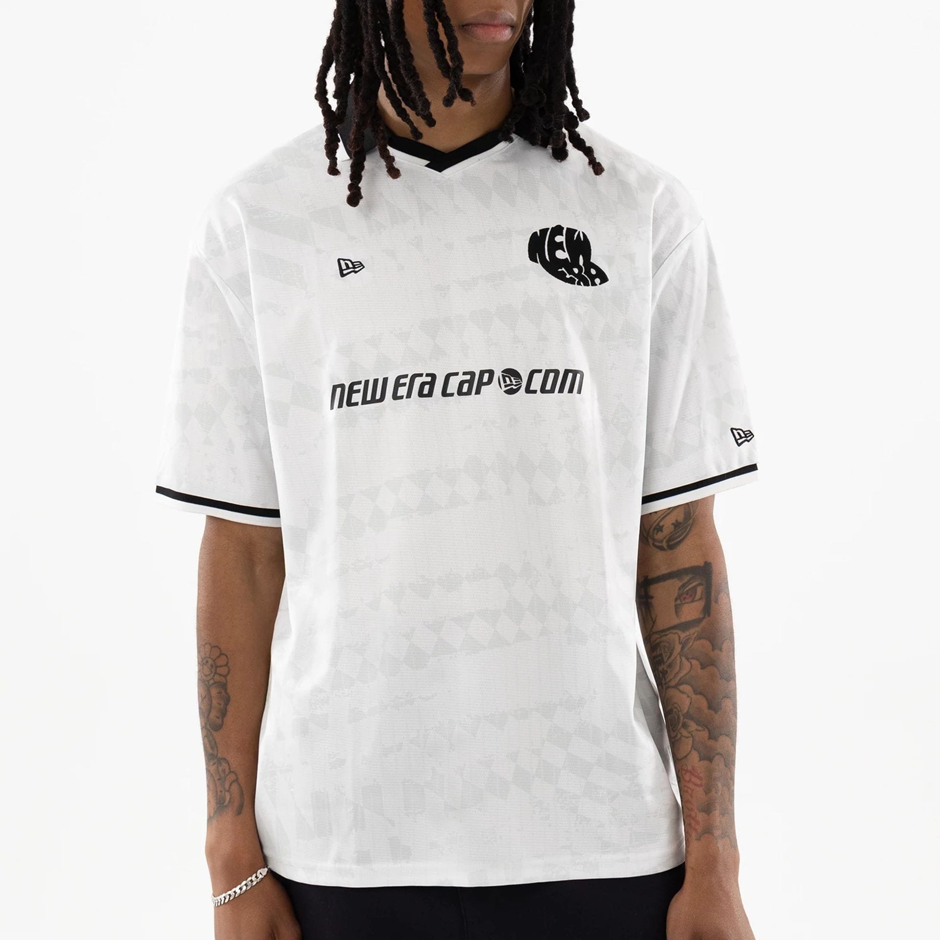 The model is wearing this New Era Soccer Jersey in white. 3