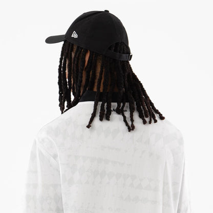 The model is wearing this New Era Soccer Jersey in white. 7