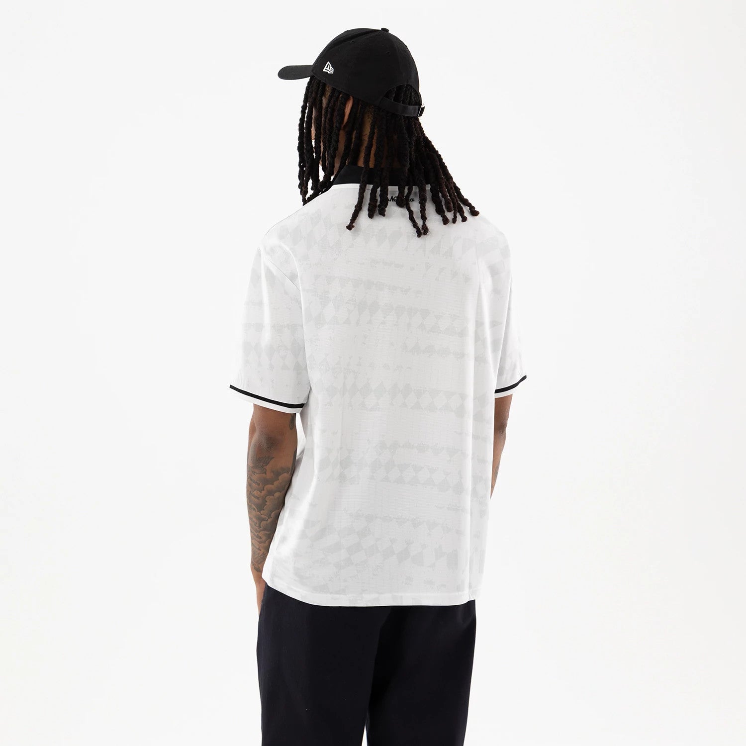 The model is wearing this New Era Soccer Jersey in white. 2