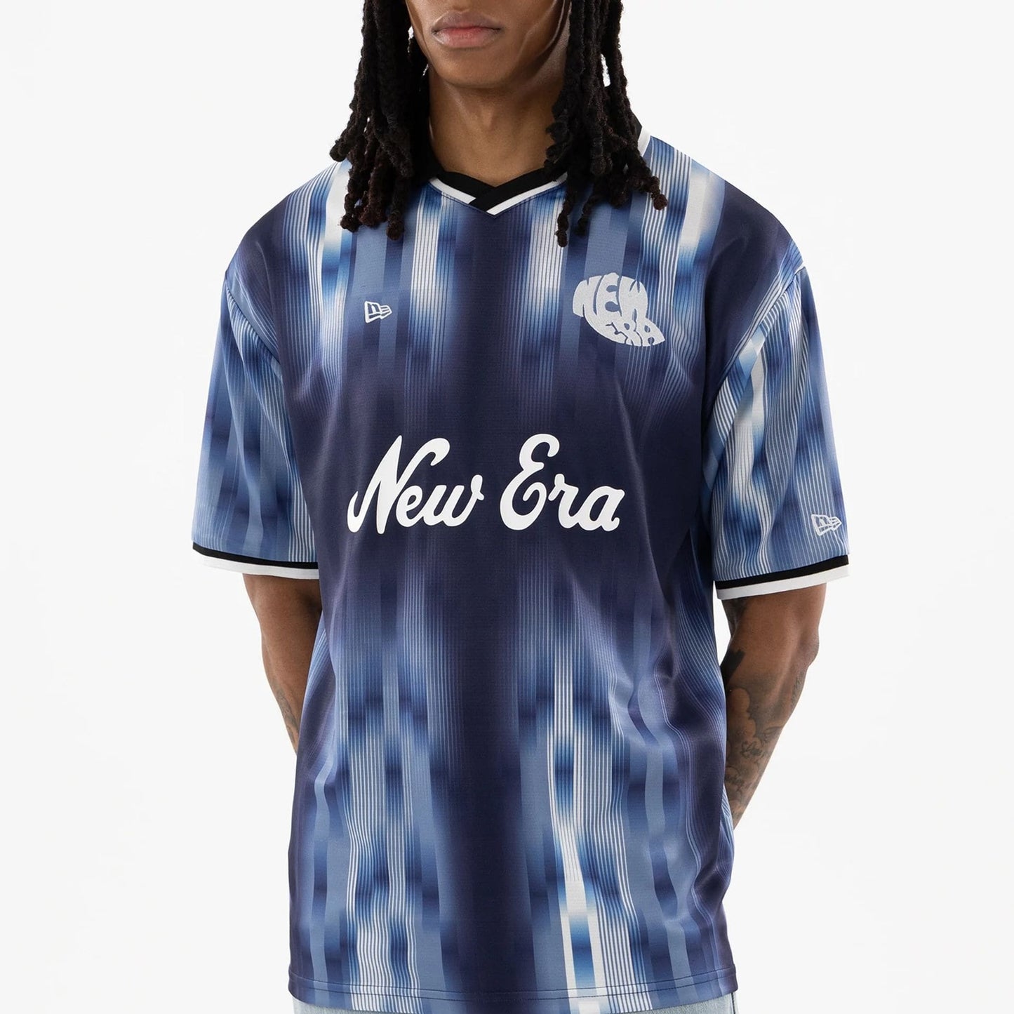 The model is wearing this New Era Soccer Jersey in navy. 3