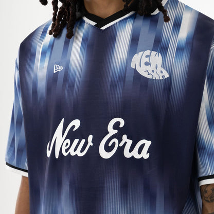 The model is wearing this New Era Soccer Jersey in navy. 5