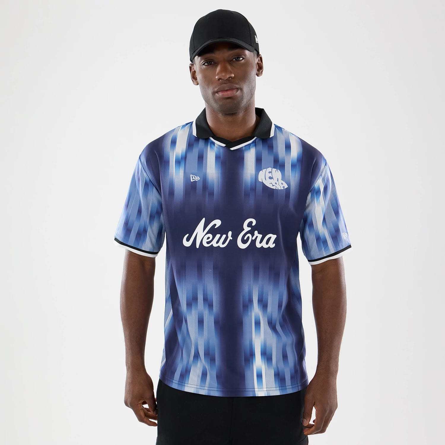 The model is wearing this New Era Soccer Jersey in navy. 1