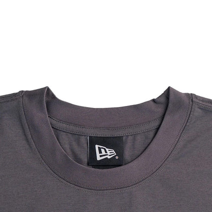 The model is wearing this New Era NEC Logo Oversized T-Shirt in black. 3