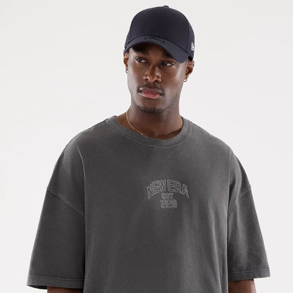 The model is wearing this New Era Street Archived Oversized T-Shirt in black. 6