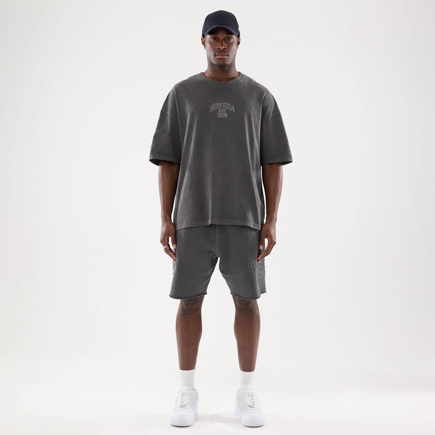 The model is wearing this New Era Street Archived Oversized T-Shirt in black. 8