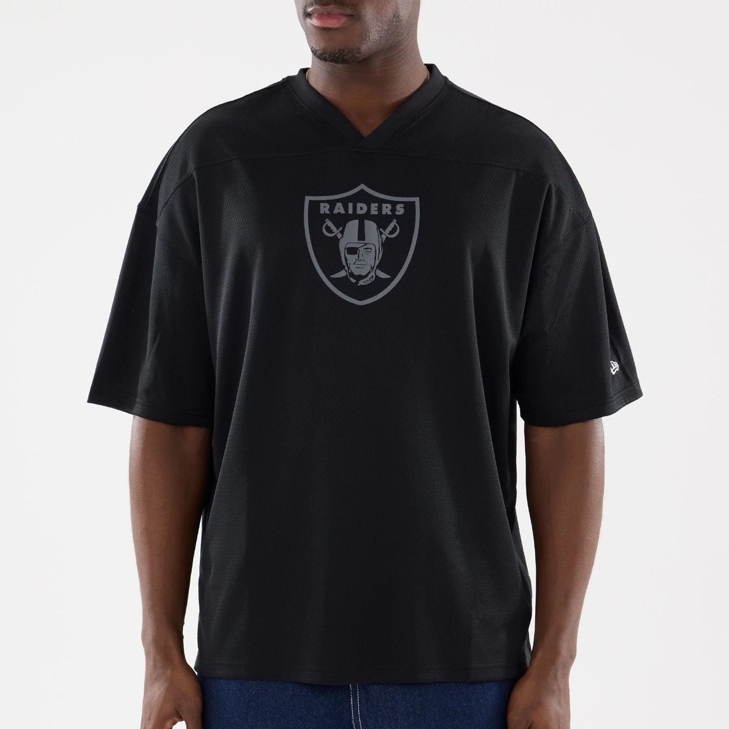 The model is wearing this NFL Raiders Wear Black Las Vegas Raiders Mesh Oversized T-Shirt in black. 3