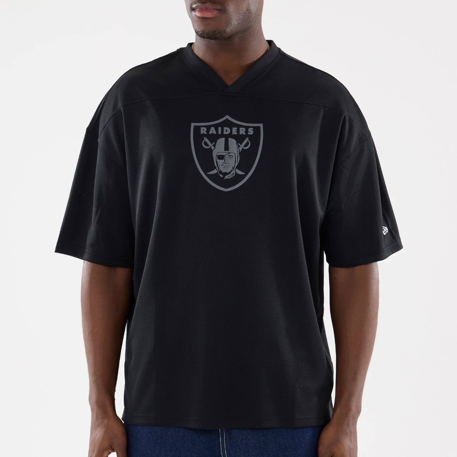 The model is wearing this NFL Raiders Wear Black Las Vegas Raiders Mesh Oversized T-Shirt in black. 3