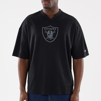 The model is wearing this NFL Raiders Wear Black Las Vegas Raiders Mesh Oversized T-Shirt in black. 3