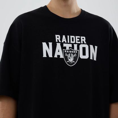 The model is wearing this NFL Rivalry Las Vegas Raiders Oversized T-Shirt in black. 3