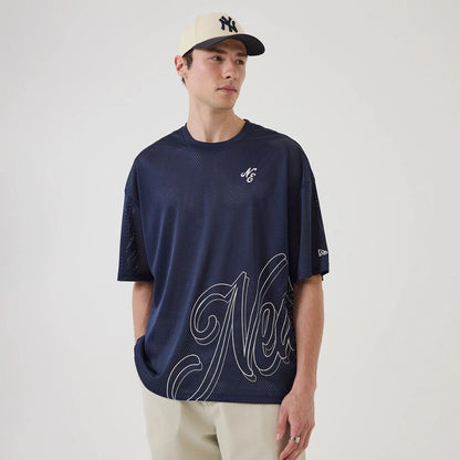 The model is wearing this New Era Mix League Oversized Mesh T-Shirt in blue. 1