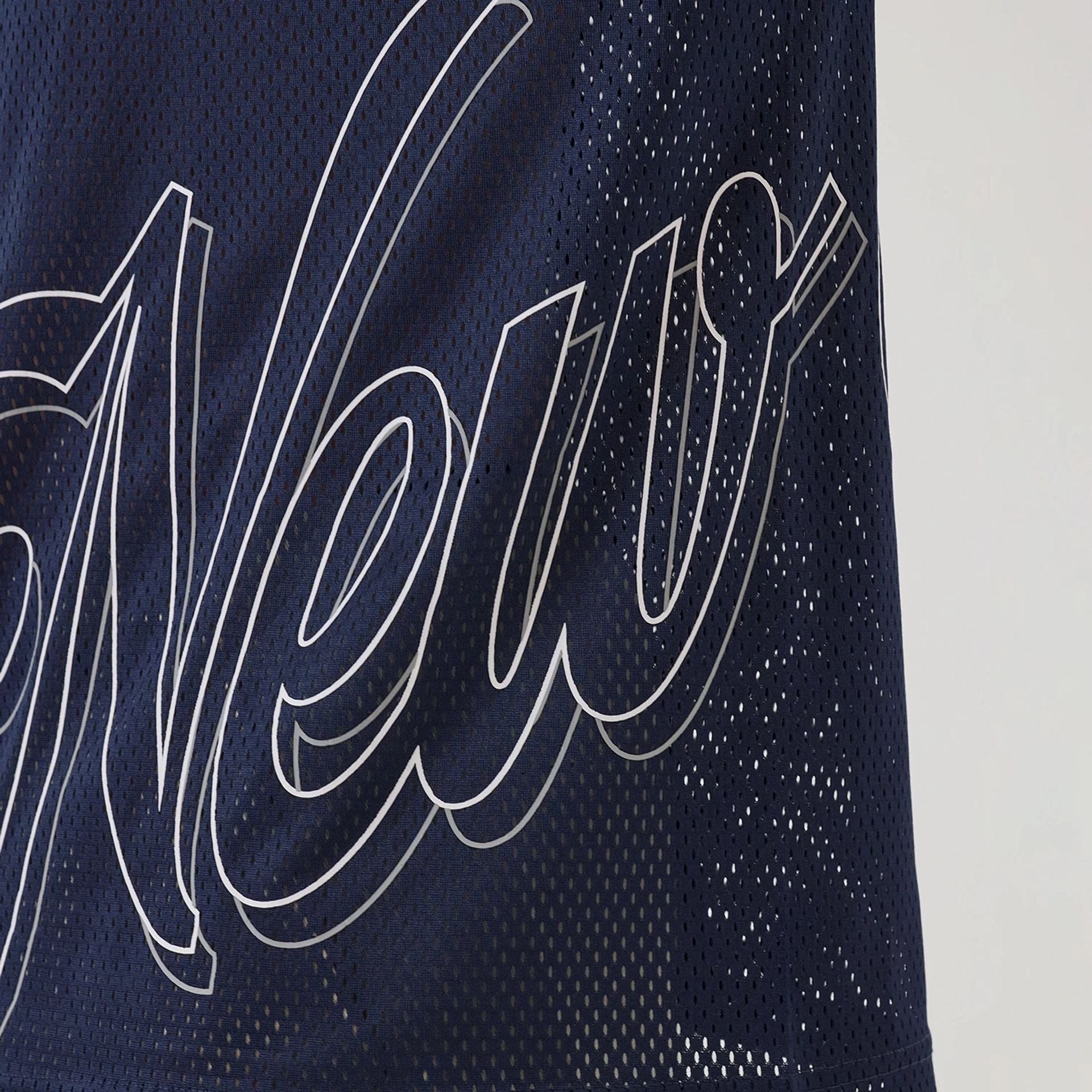 The model is wearing this New Era Mix League Oversized Mesh T-Shirt in blue. 4