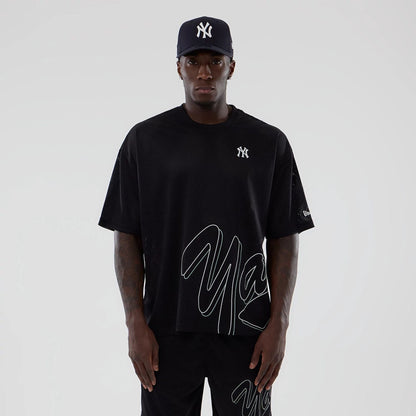 The model is wearing this MLB Mix League New York Yankees Oversized Mesh T-Shirt in black. 1