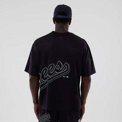 The model is wearing this MLB Mix League New York Yankees Oversized Mesh T-Shirt in black. 2