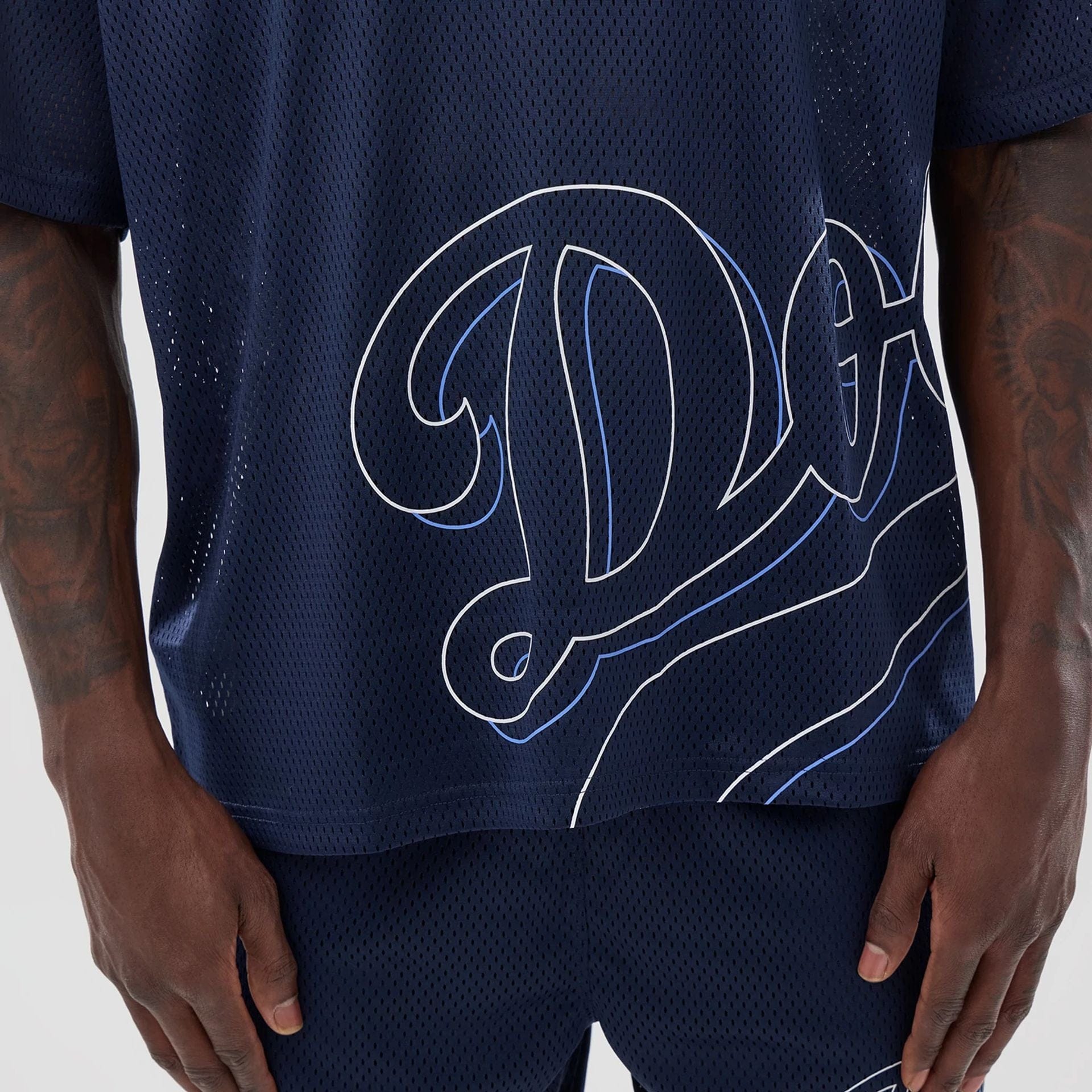 The model is wearing this MLB Mix League LA Dodgers Oversized Mesh T-Shirt in blue. 6