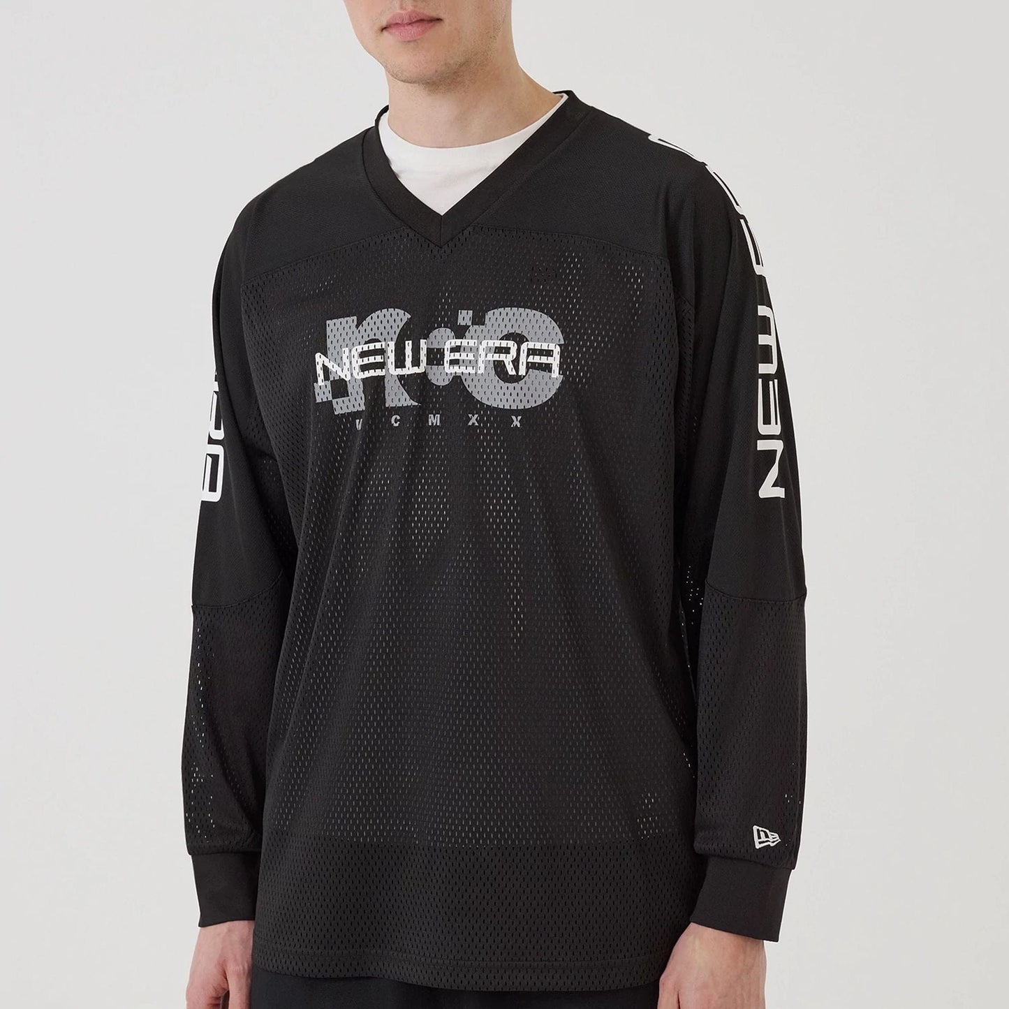 The model is wearing this New Era Urban Core Long Sleeve Jersey in black. 6