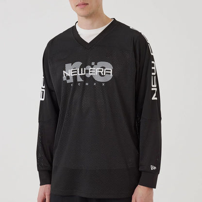 The model is wearing this New Era Urban Core Long Sleeve Jersey in black. 6