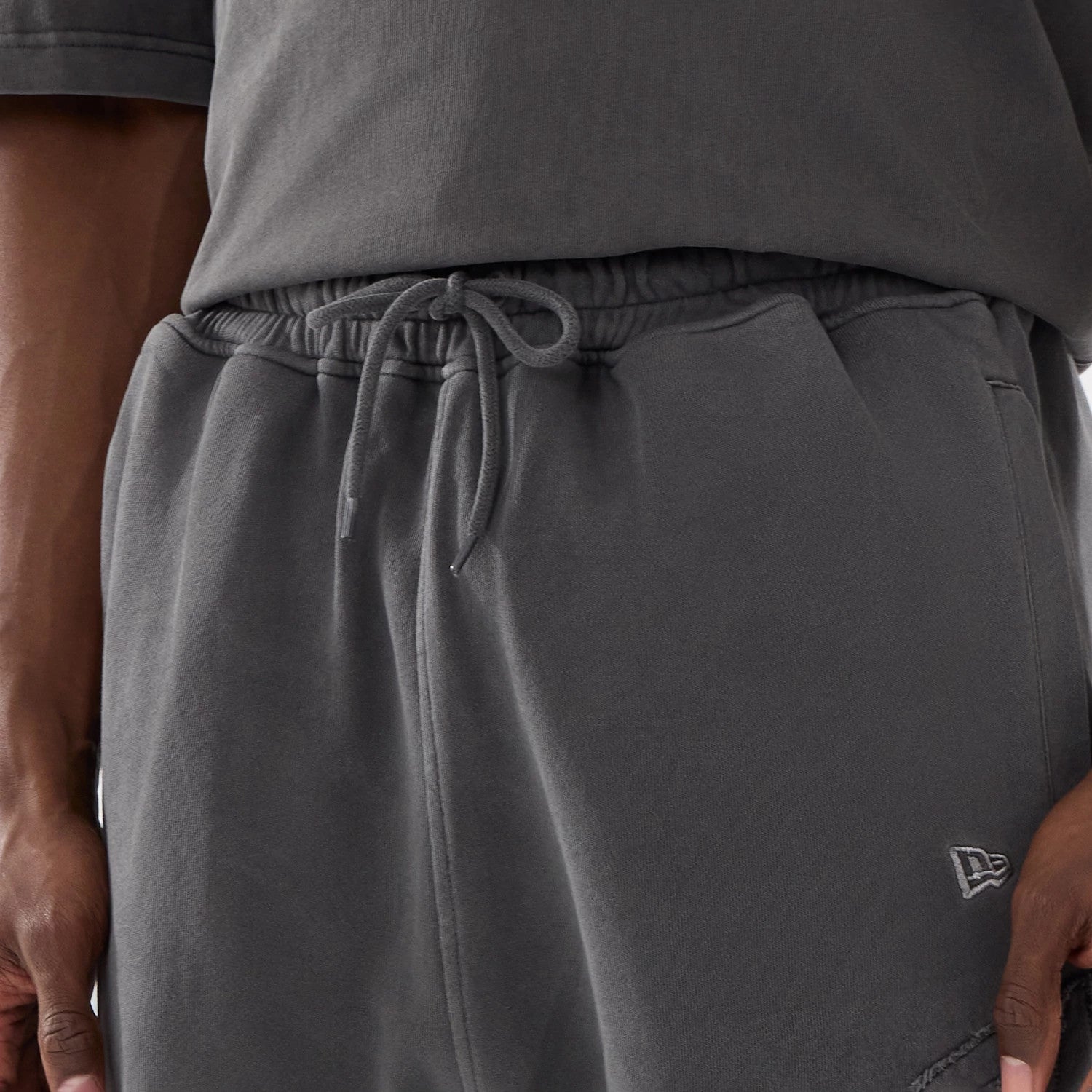 The model is wearing this New Era Street Archived Oversized Shorts in black. 6