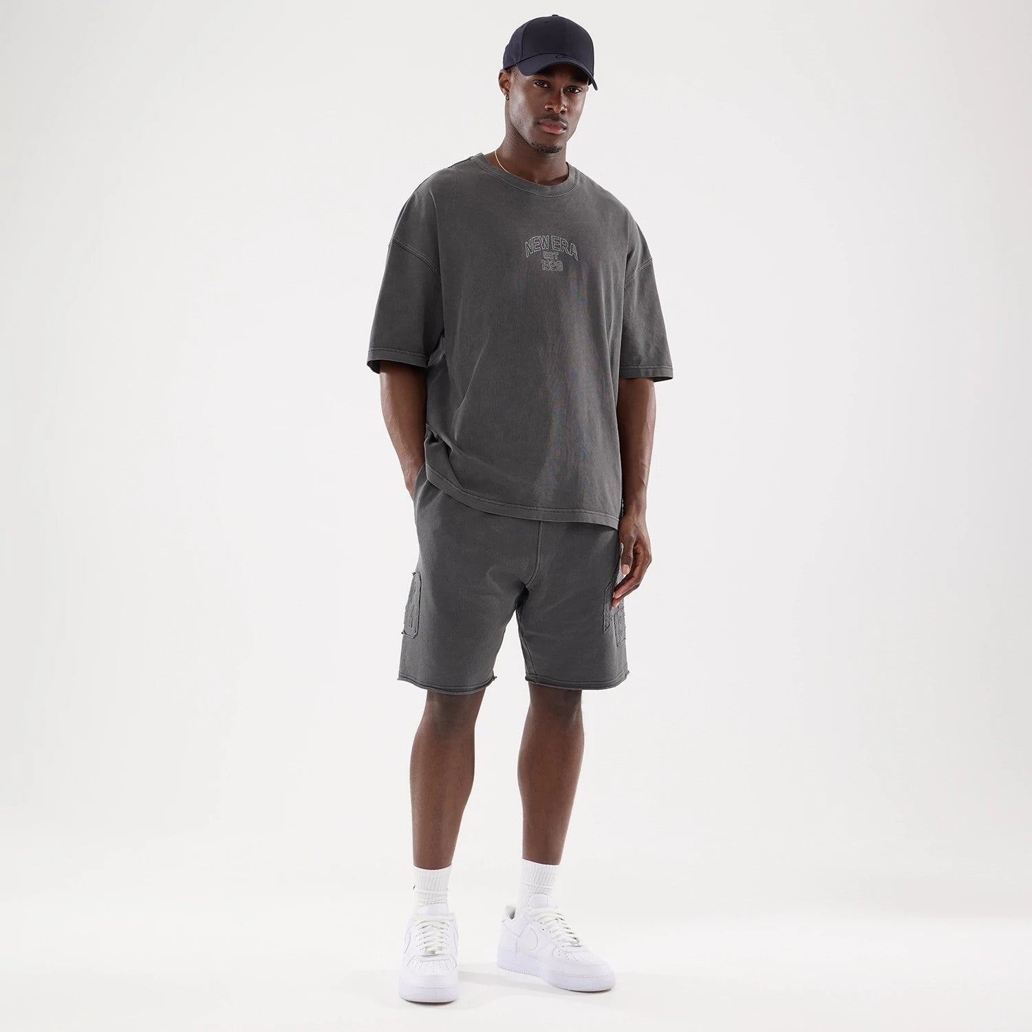The model is wearing this New Era Street Archived Oversized Shorts in black. 8