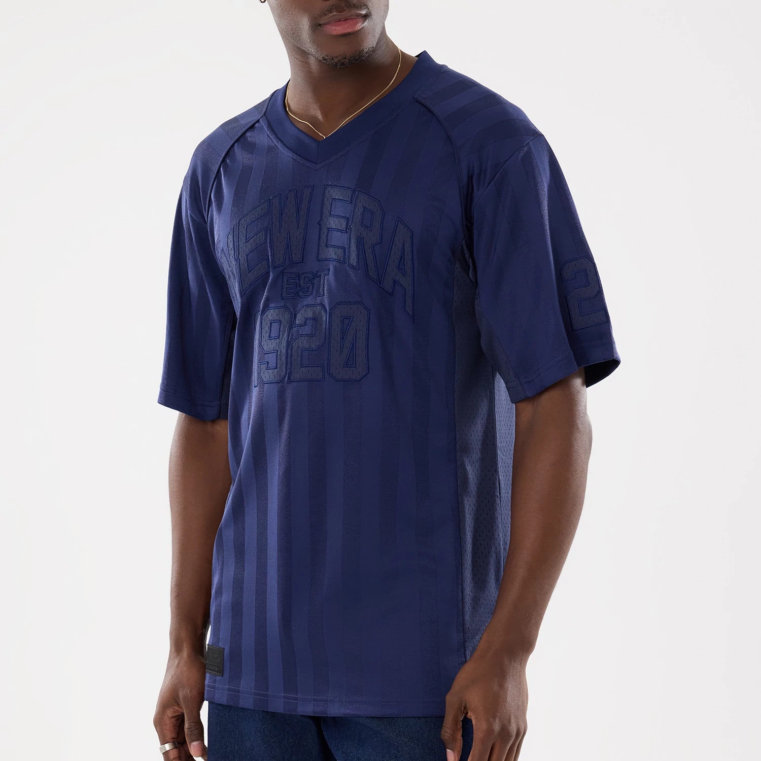 The model is wearing this New Era Street Archived Mesh Jersey in navy. 3