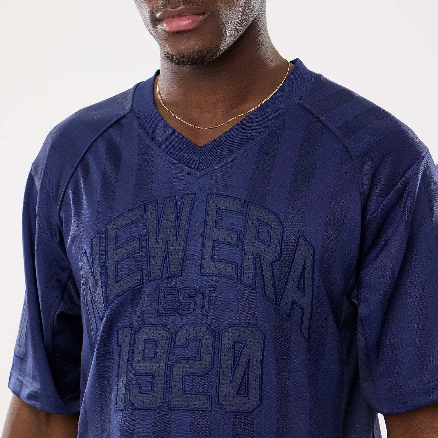 The model is wearing this New Era Street Archived Mesh Jersey in navy. 4
