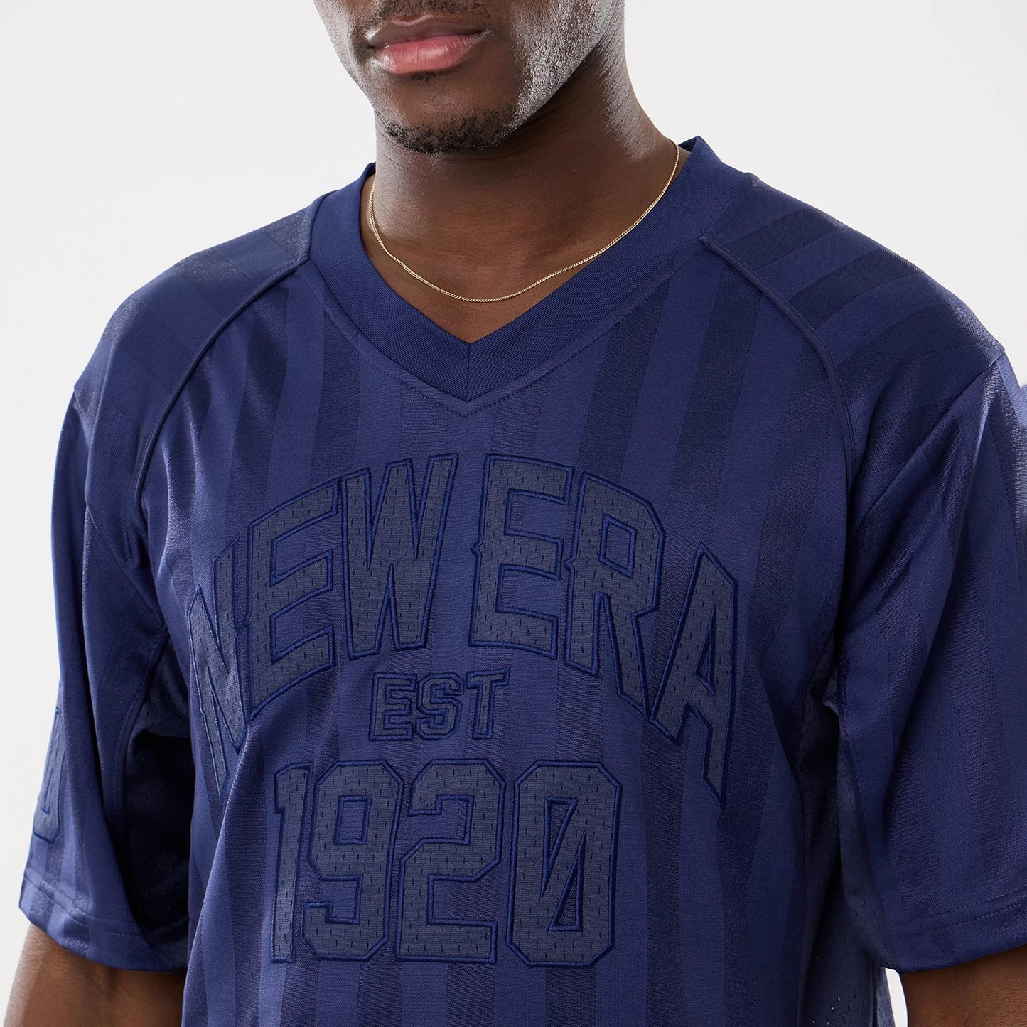The model is wearing this New Era Street Archived Mesh Jersey in navy. 4