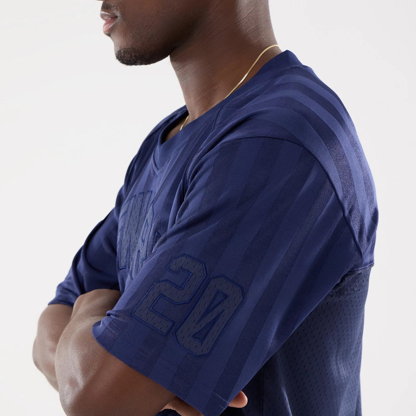 The model is wearing this New Era Street Archived Mesh Jersey in navy. 5
