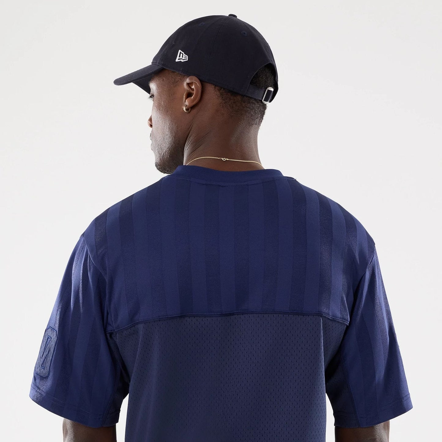 The model is wearing this New Era Street Archived Mesh Jersey in navy. 7