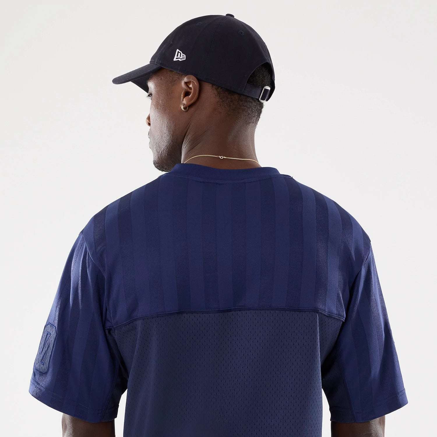 The model is wearing this New Era Street Archived Mesh Jersey in navy. 7