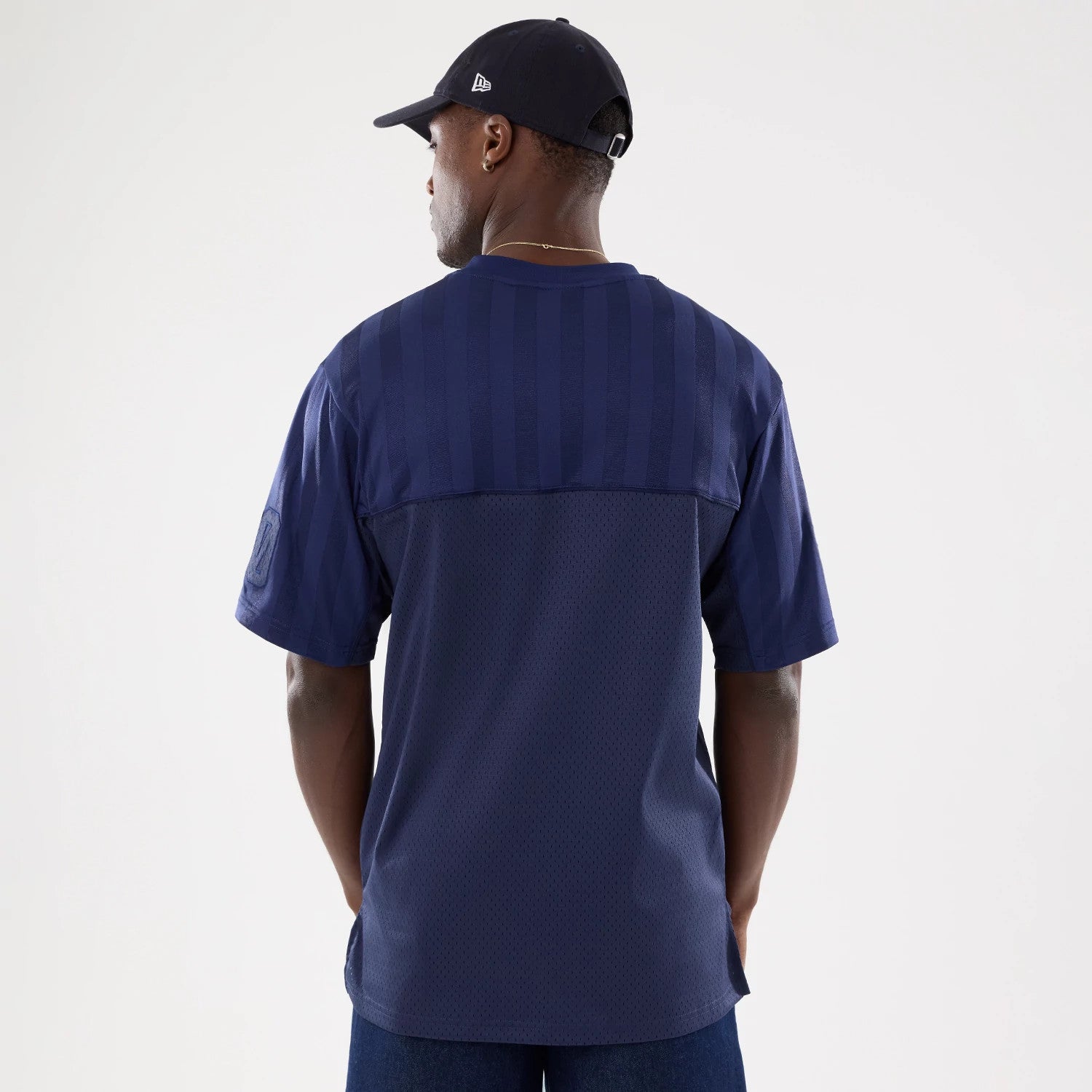 The model is wearing this New Era Street Archived Mesh Jersey in navy. 2