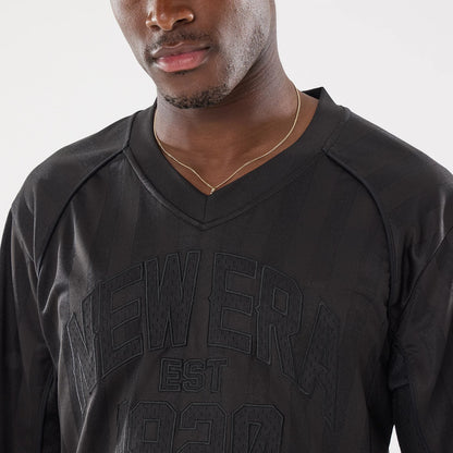 The model is wearing this New Era Street Archived Mesh Jersey in black. 4