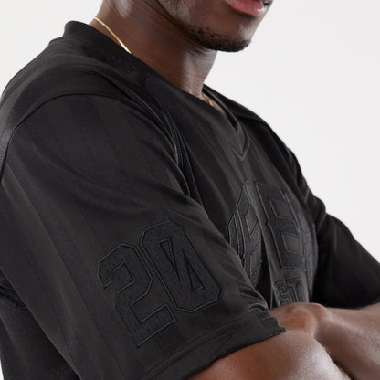 The model is wearing this New Era Street Archived Mesh Jersey in black. 6